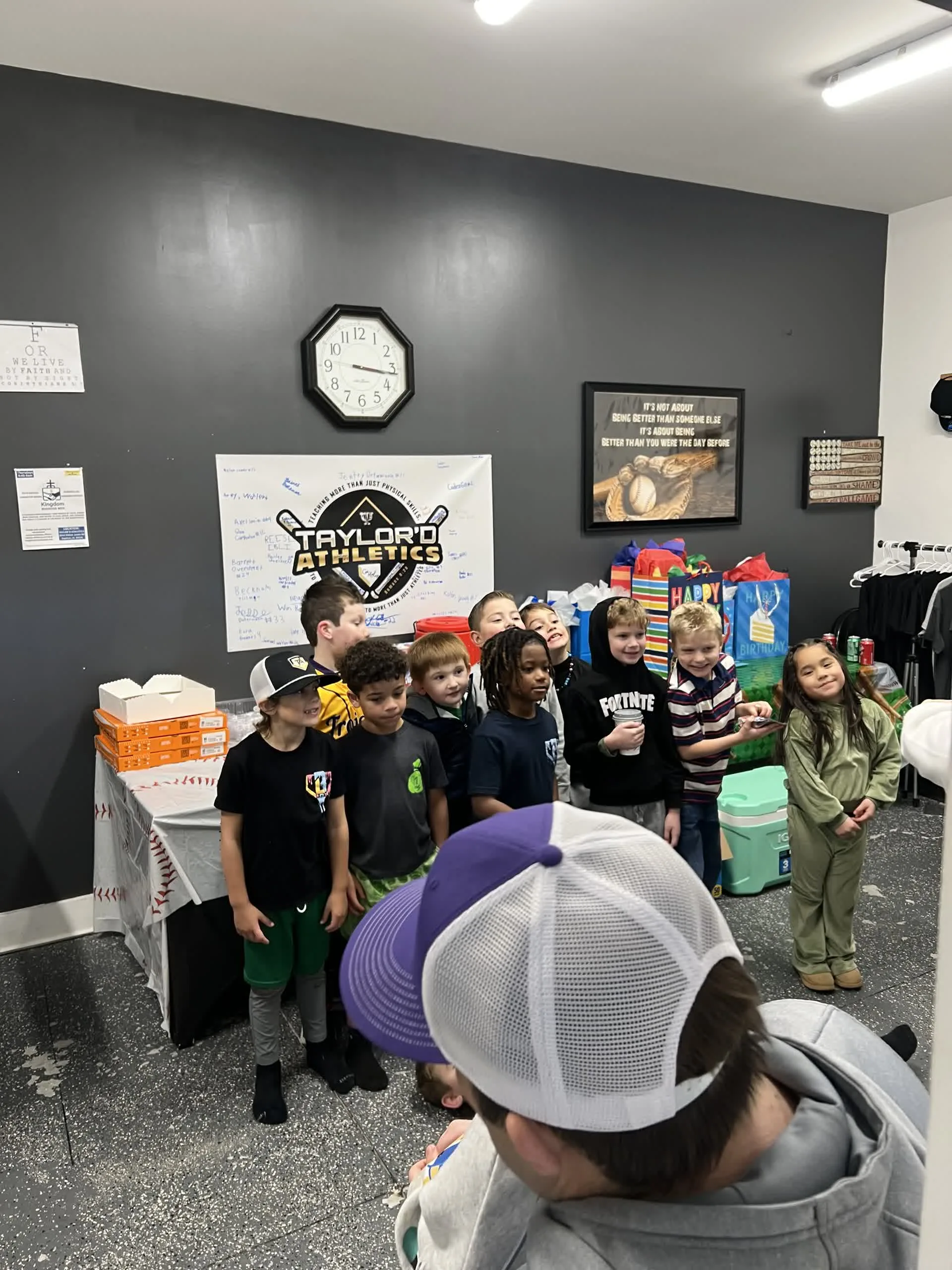 Kids gathering together in the party room at Taylor'd Athletics