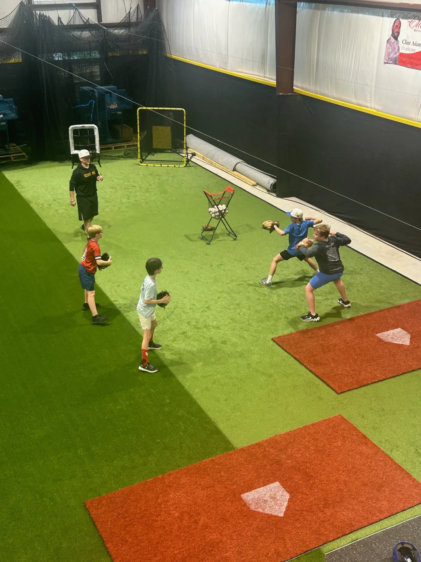 Overhead view of youth athletes running a fielding drill