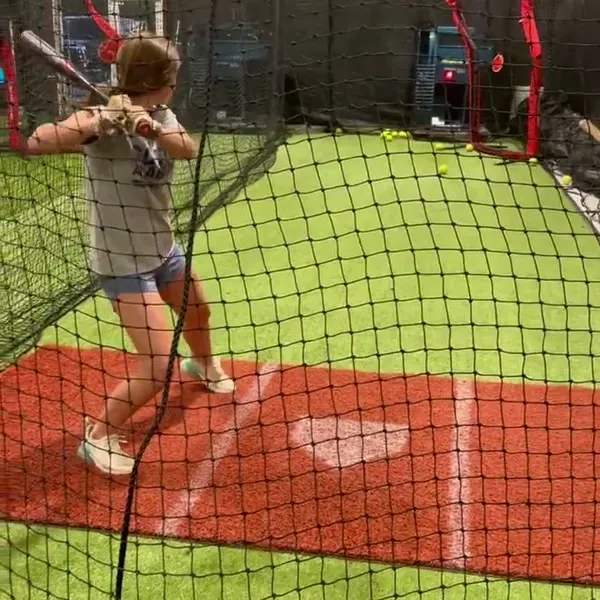 Hitting drill close-up showing swing mechanics