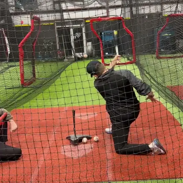 Close-up of a batter working the tee drill