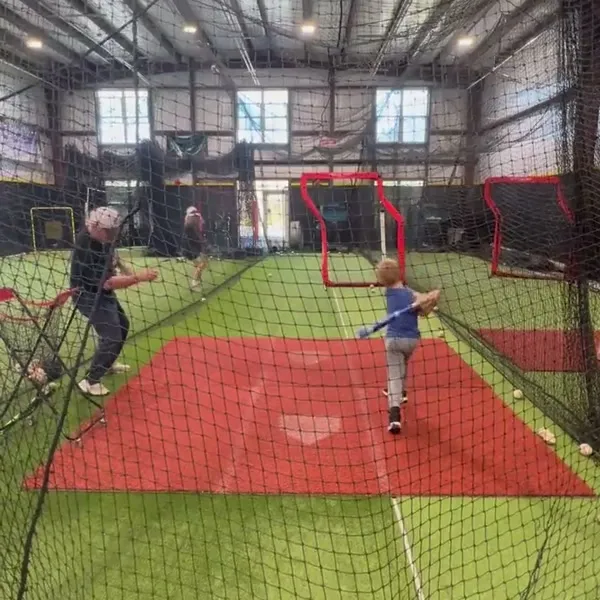 Young kid batting during practice