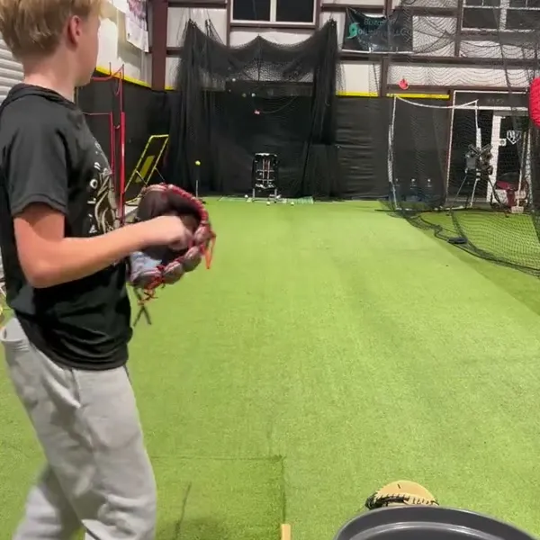 Youth athlete in fielding position ready to throw