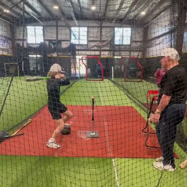 Youth athlete running a hitting drill