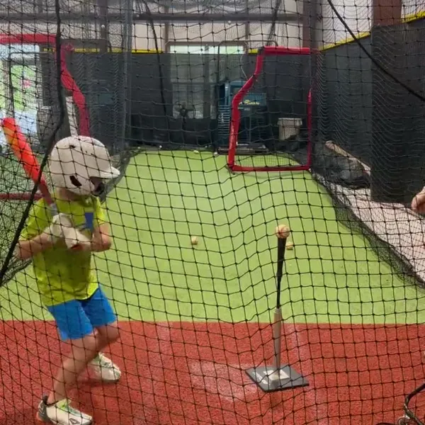 Youth athlete hitting from the tee
