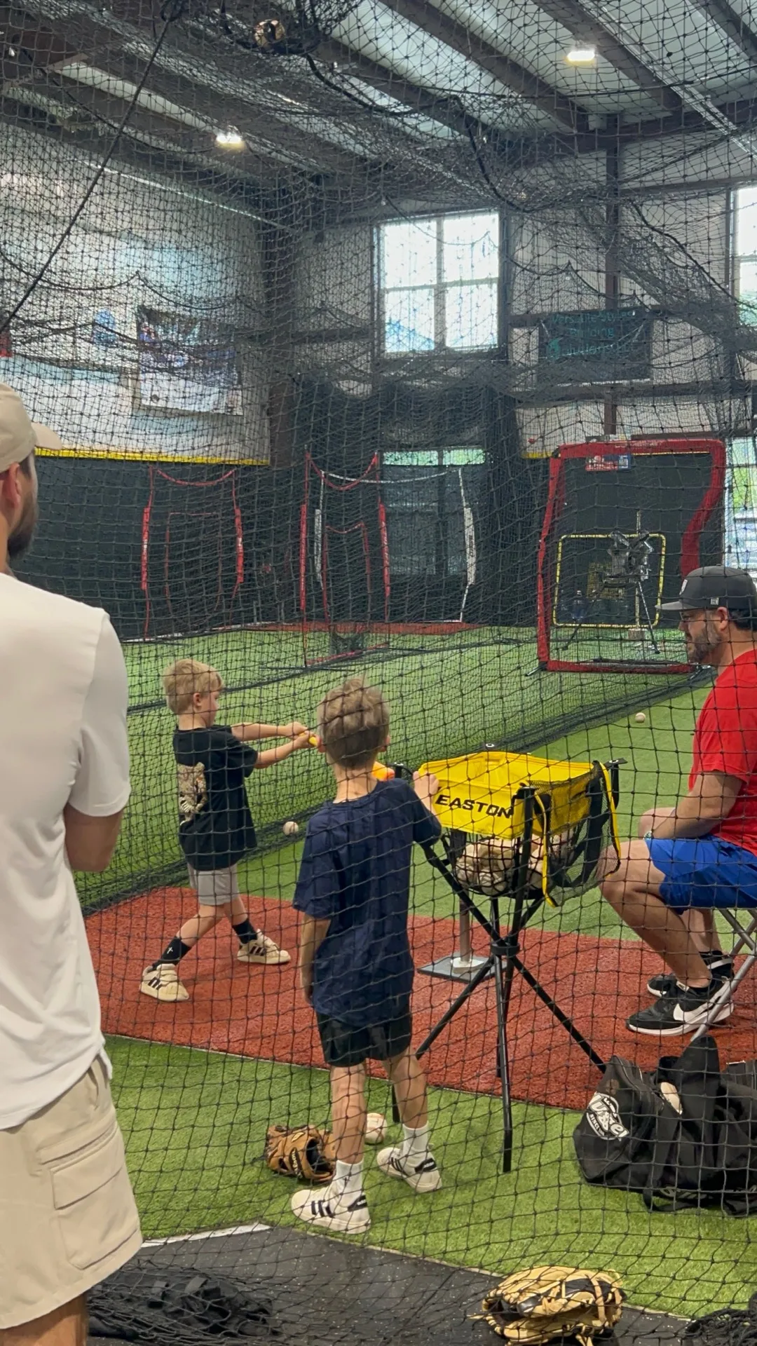 Young kids working on batting tee drills